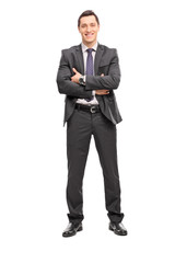 Confident young businessman in a gray suit