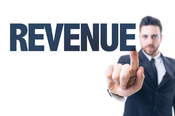 Business man pointing the text: Revenue