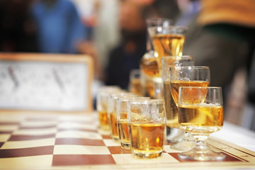 Chess set/Chess table with glass of drink