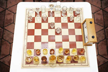 Chess set/Chess table with glass of drink