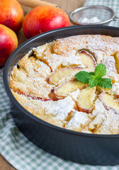 Peach clafoutis in a baking dish