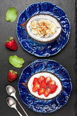 Fototapeta na wymiar Chia seeds coconut pudding with berries and fruit. super food. top view