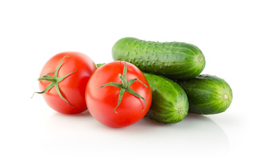 Fresh Tomatoes and Cucumbers isolated on white background