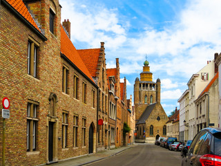 Fototapeta na wymiar The street with ancient houses in Bruges, Belgium