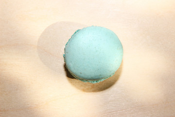 Blue macaroon on wooden background