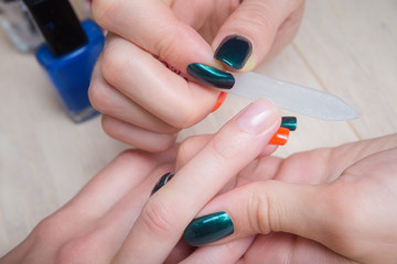 Obraz na płótnie Canvas Home manicure process, getting nails into shape