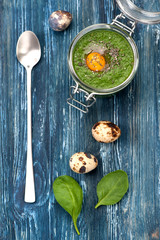 Green smoothie spinach with quail egg. Top view horizontal