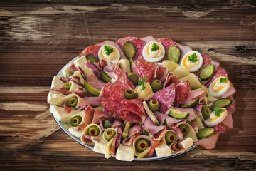 Plate of Serbian Meze, on very old Wooden Table surface.