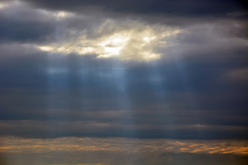 Sun through the stormy clouds. Natural background