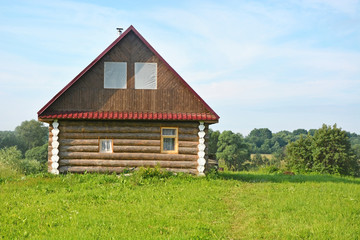 Obraz premium Small bath house on the hill at summer day
