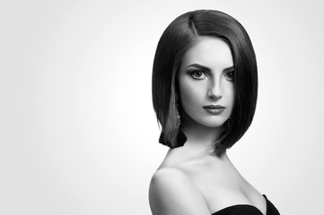 black and white portrait of a beautiful young woman with a bob h