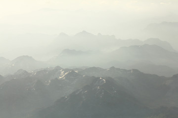 Mountain landscape in the mist on the horizon