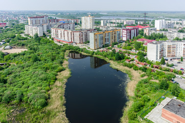 Fototapeta na wymiar Residential district and Gipsy lake. Tyumen.Russia