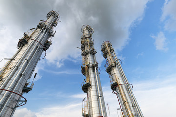 Three distillation towers point to sky : Oil and Gas Refinery
