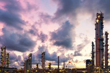 Violet and blue twilight scene of oil and gas refinery skyline