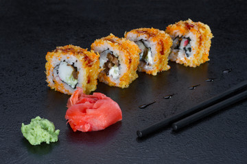 sushi roll on a black background