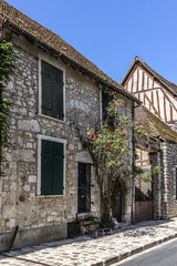 Fototapeta na wymiar Old stone house near city wall in Provins. France.