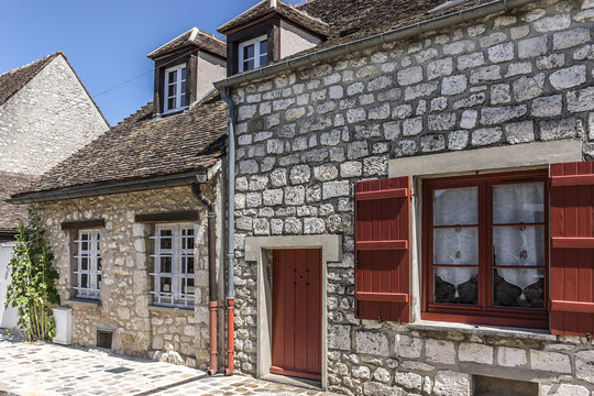 Old stone house near city wall in Provins. France.