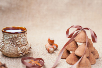Fototapeta na wymiar Chocolate truffles candies and vintage glass of milk or cream