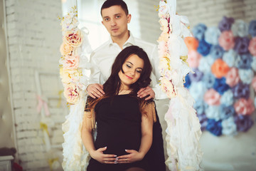 Pregnant - Woman's happiness. Beautiful young brunette woman is