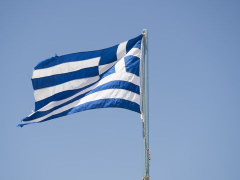 Greek flag against clear blue sky