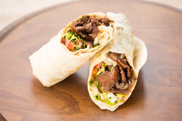 Doner kebab on wooden background