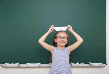 Schoolgirl near school board