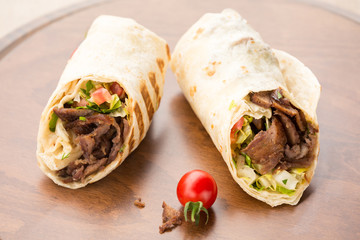 Doner kebab on wooden background