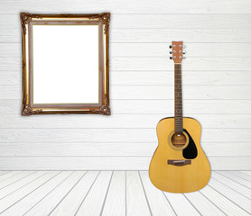 Obraz premium Guitar and picture frame in room