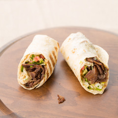 Doner kebab on wooden background