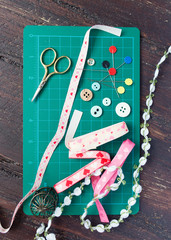 Patchwork sewing tools on green mat