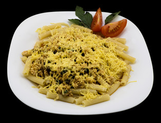 Dish of meat, vegetables, spices, basil, herbs and cheese - pasta alla carbonara isolated on black