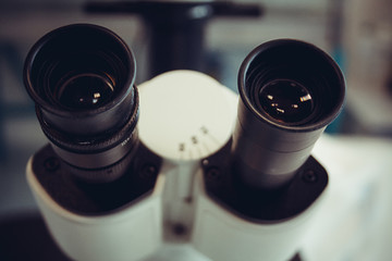 Microscope eyepiece closeup as background