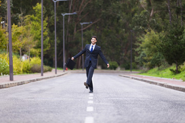 Businessman walking on the road line