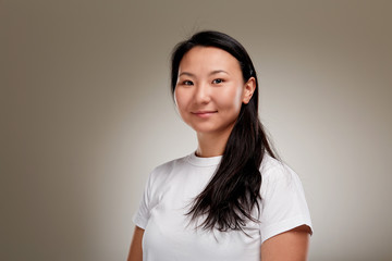 Portrait of young asian woman with long black hair