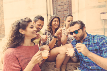 Group of tourists eating slush in Italy - obrazy, fototapety, plakaty
