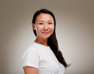Portrait of young friendly asian woman