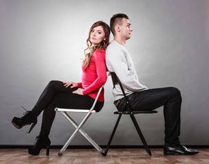 Obraz premium Unhappy couple sitting back to back. Disagreement.