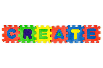 color alphabet jigsaw on white background in word "Create"