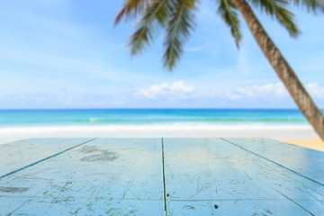 Top of wood table and view of tropical beach