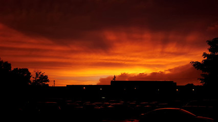 Fiery Orange Sunset Over Parking Lot