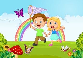 Cartoon kids catching butterfly in the jungle
