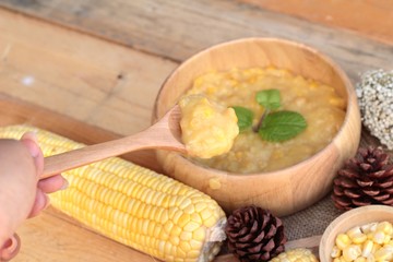 Corn soup of condensed in a wooden bowl
