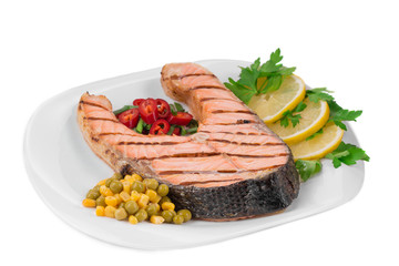 Fried salmon fillet on plate. 