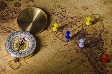 compass with marked location on old map