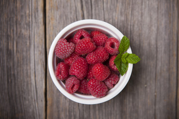 Fresh summer raspberries with mint leaf