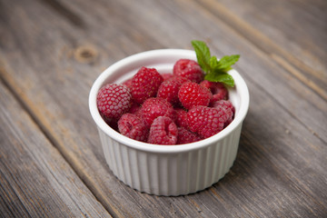 Fresh summer raspberries with mint leaf