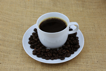 hot coffee in cup coffee on the hemp sack