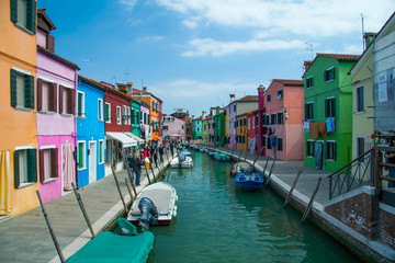 Fototapeta na wymiar Colouful houses along the canal on Burano island, Italy