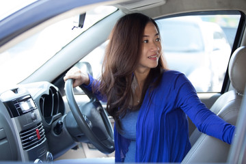 Young Asian woman on ride, a car.